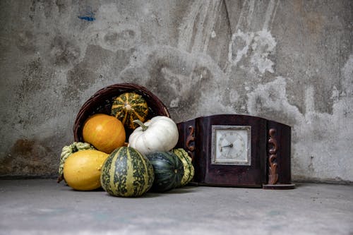 Autumn Decoration With Pumpkins and an Old Clock
