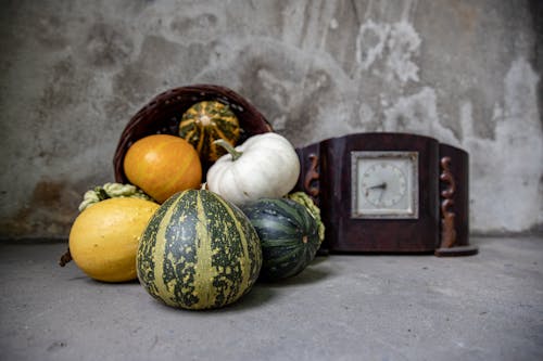 Pumpkins near Vintage Clock