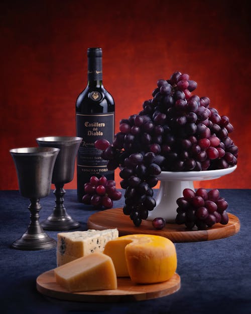 Bottle of Wine, Grapes and Cheese