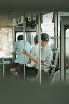 Passengers seated inside a public bus, capturing a casual urban commute.
