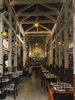 Spacious restaurant interior in Sicily with vintage design, ideal for dining experiences.