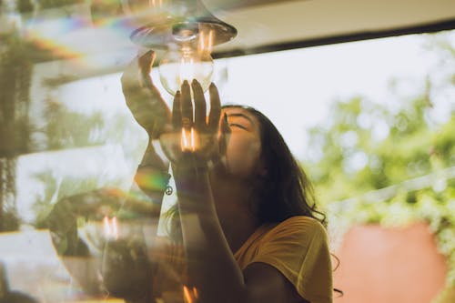 Free Woman Holding A Bulb Stock Photo