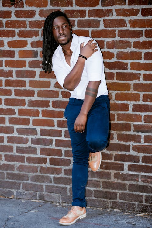 Model in a White Short Sleeved Shirt and Navy Blue Pants