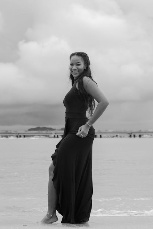 Smiling Model in Dress on Sea Shore