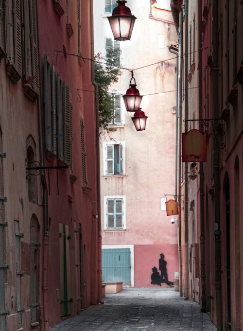 Lamps over Empty, Narrow Street in Town