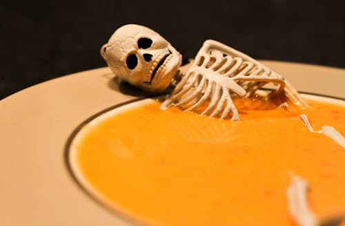 Skeleton in a Halloween Pumpkin Soup 