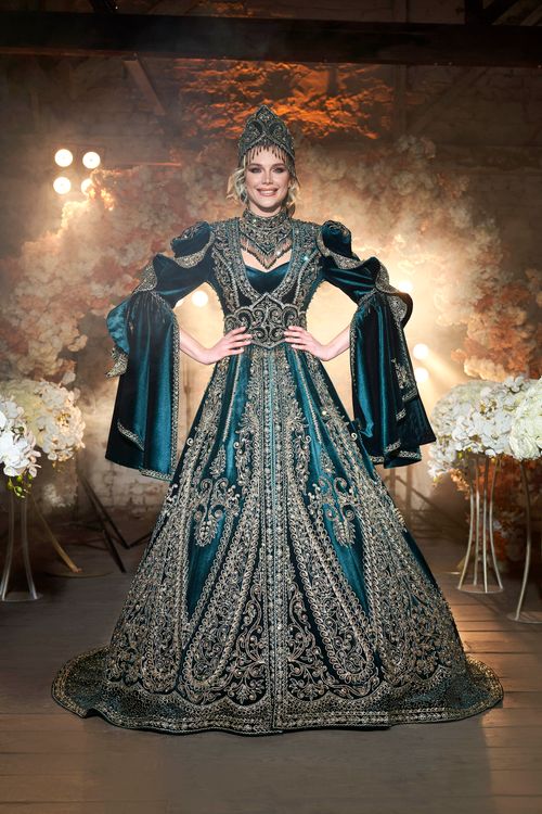Free Woman in ornate traditional dress poses in İzmir studio setting Stock Photo
