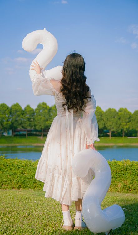 Woman in White Dress Standing with Birthday Balloons Free Stock Photo Woman in White Dress Standing with Birthday Balloons Free Stock Photo