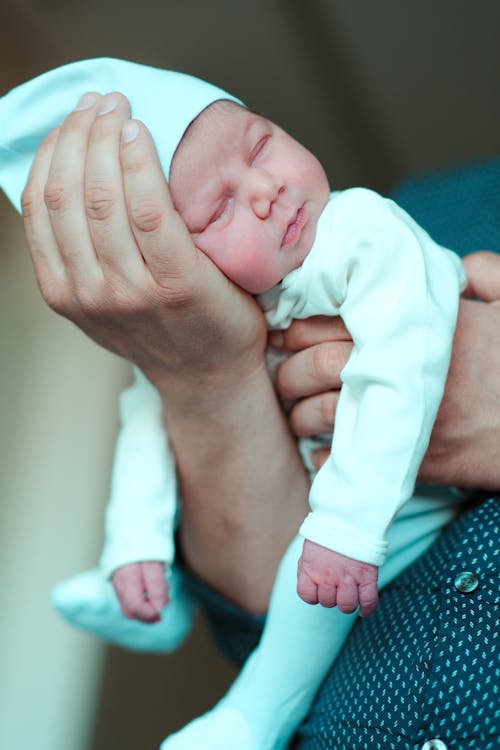 Woman Holding a Newborn 