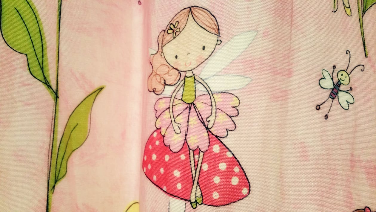 Free Close-up Photo of Pink and Red Fairy Graphic Textile Stock Photo