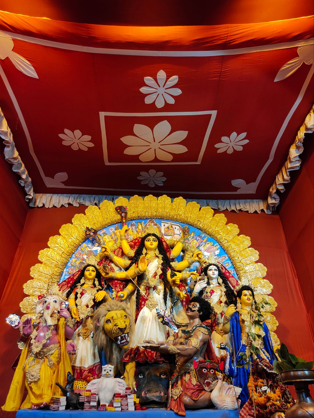 Traditional Durga Puja statues in a shrine