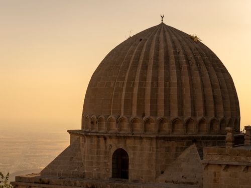 Free Serene view of a historic dome in Mardin, Turkey at sunrise, capturing architectural beauty. Stock Photo