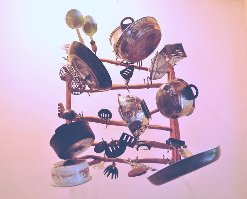 Kitchen Cookware Piled Up on Brown Wooden Rack