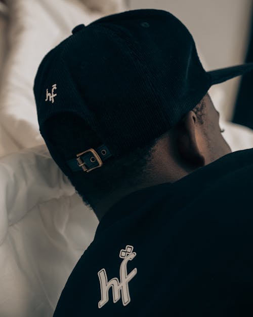 Close-up of Black Man in Baseball Hat and T-Shirt