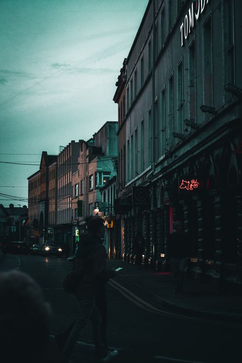 Free A captivating twilight view of Galway's bustling city street. Urban life meets historic architecture in Ireland. Stock Photo