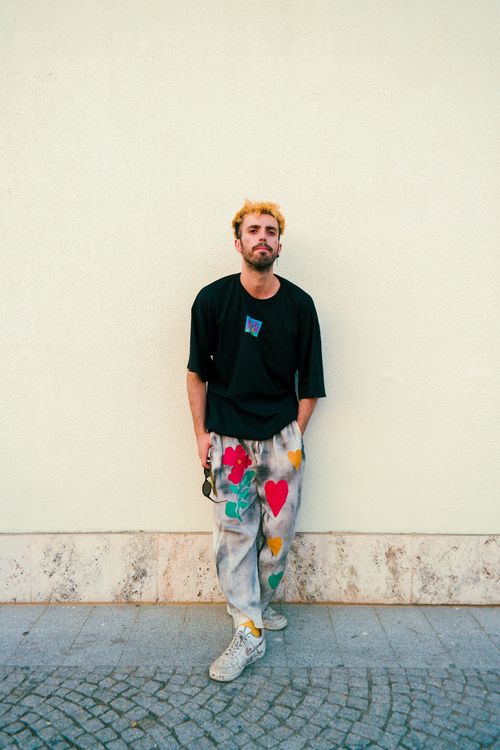 Free Fashion portrait of a man with artistic, painted pants and casual style. Stock Photo