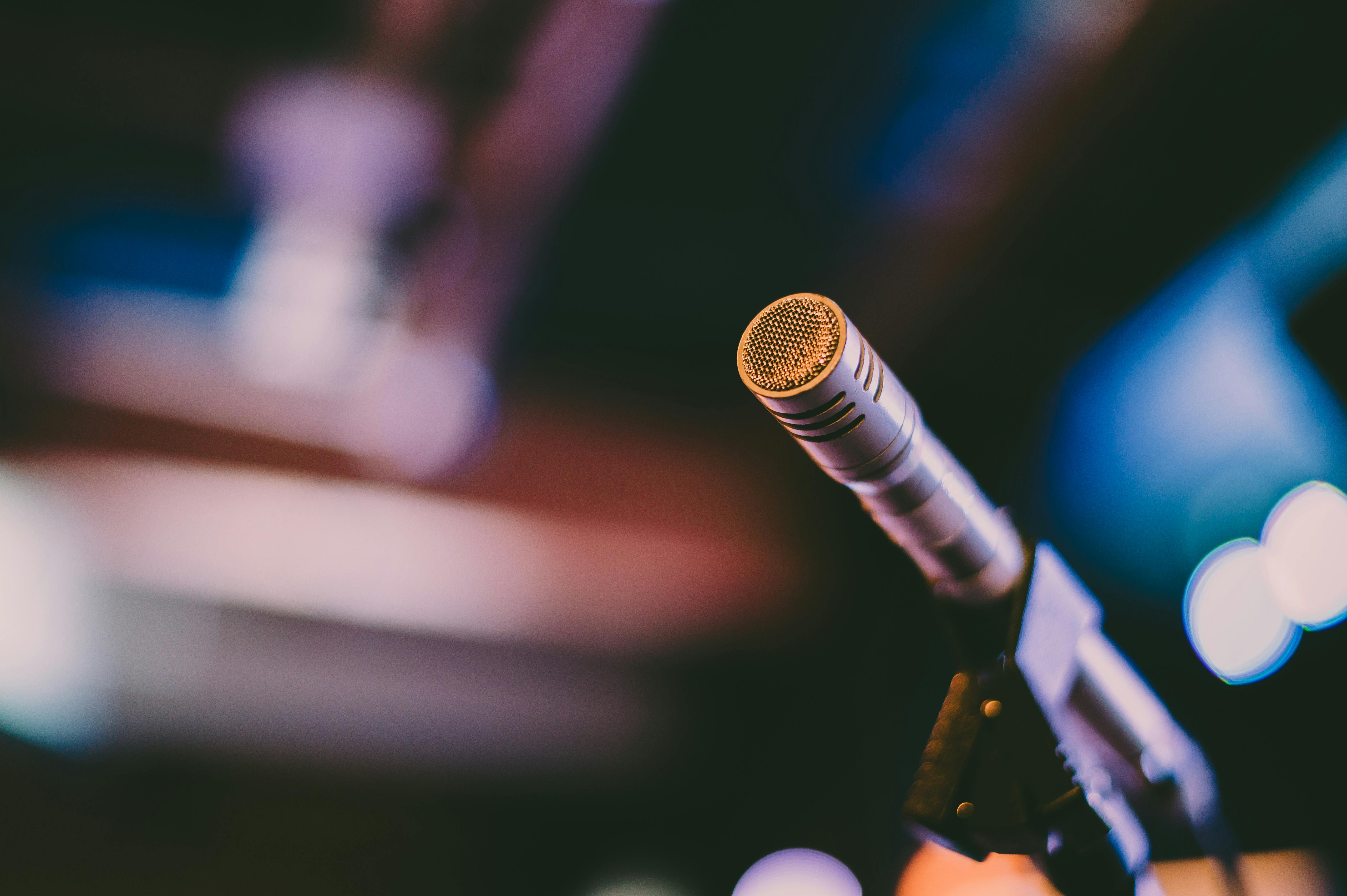 selective focus photography of grey microphone