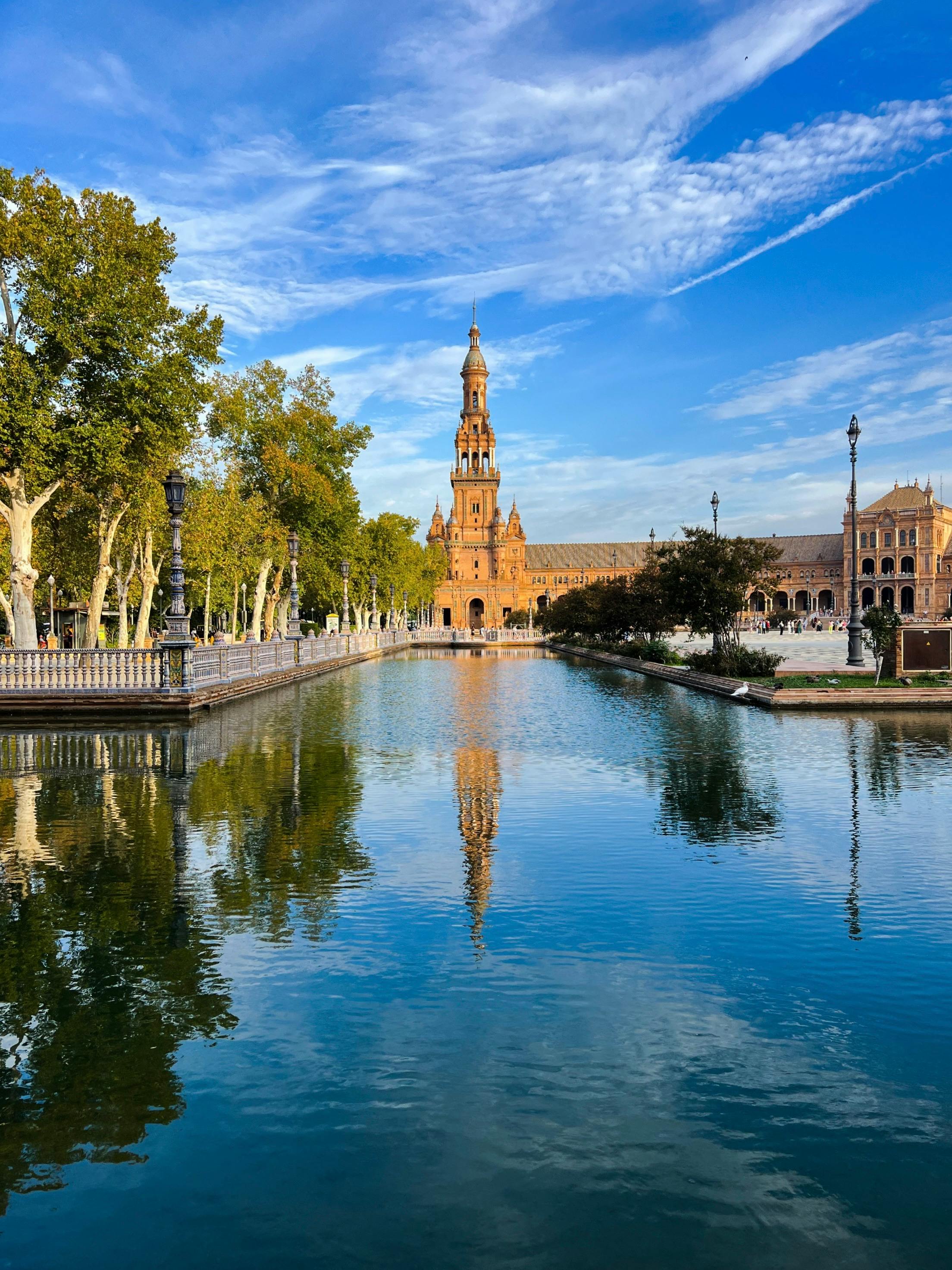 moat and north tower of the water utility company building on spain square in seville