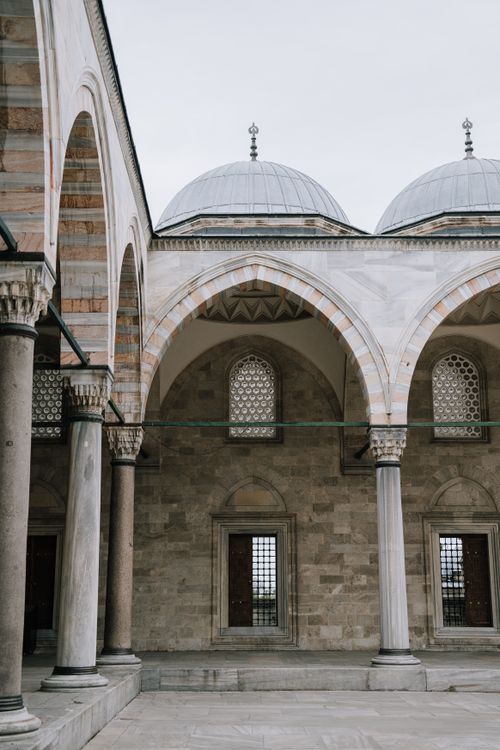 Free Beautiful arches and domes of Suleymaniye Mosque's historic courtyard in Istanbul, Turkey. Stock Photo