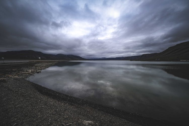 Storm Clouds Reflecting In Lake