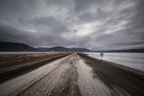 Worn Out Road Along a Frozen Lake