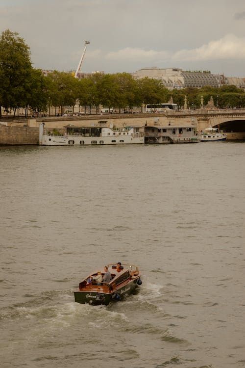 Motorboat on River in City