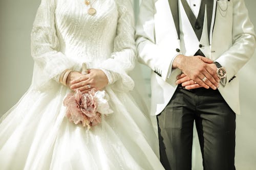Close up of Newlyweds in Wedding Dress and White Suit