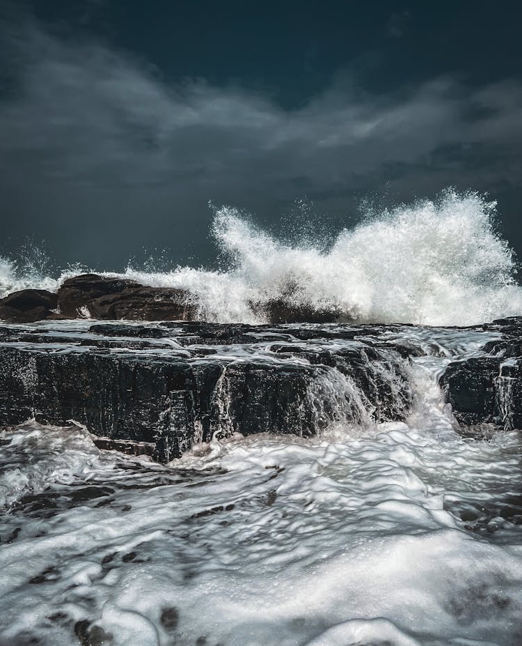 Splashing Sea Waves Under Storm Clouds