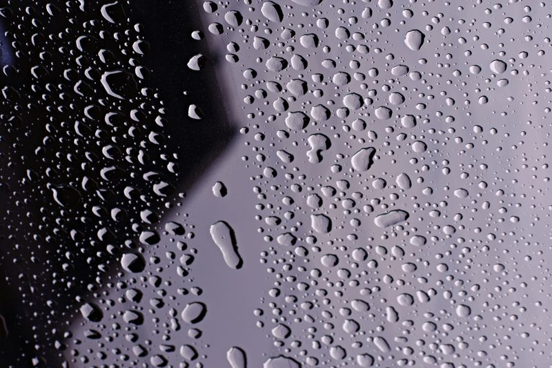 Close-up of clean water droplets on glass