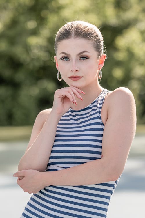 Portrait of Blonde Woman Wearing Striped Blouse