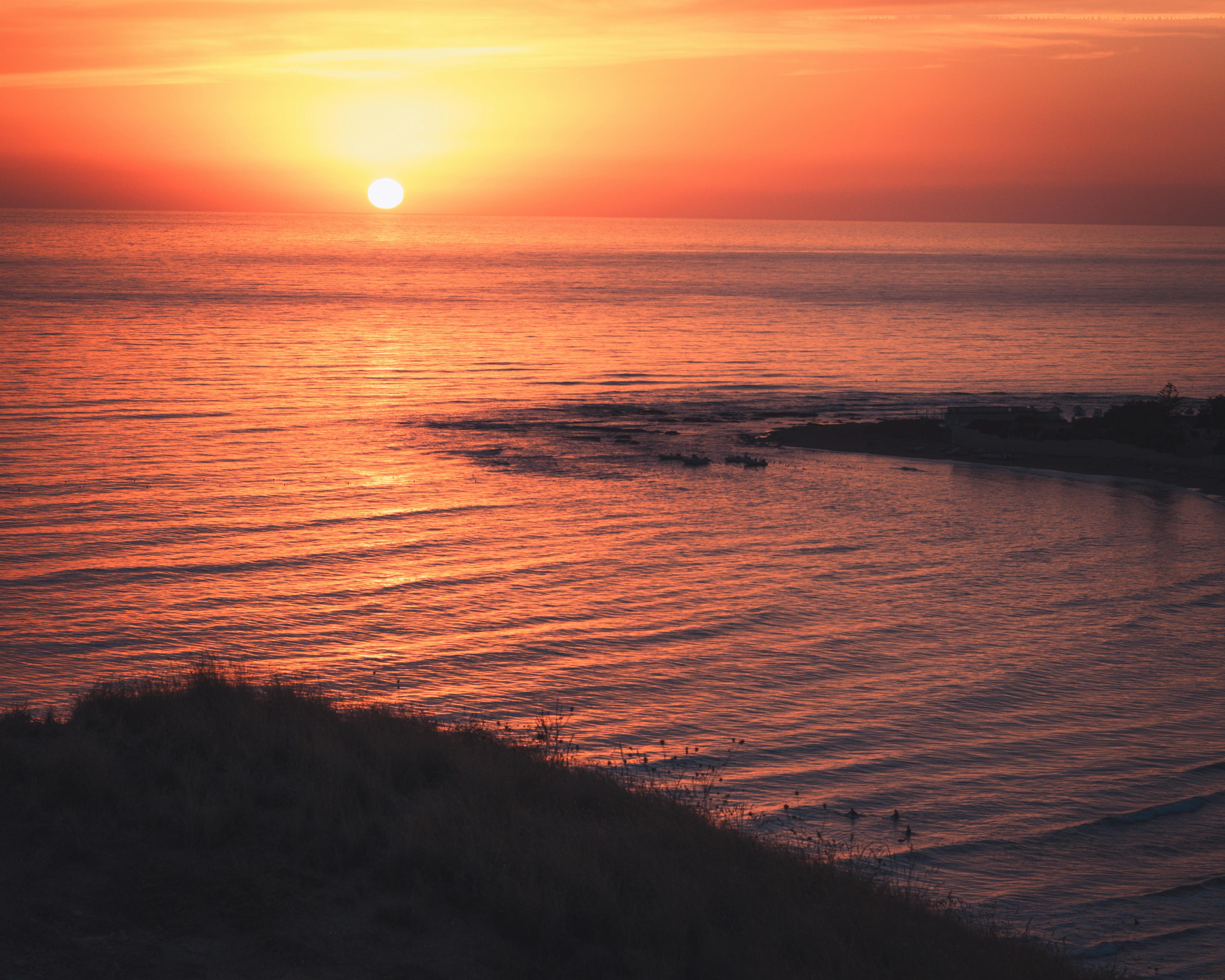 Hill Silhouette On Sea Shore At Sunset Free Stock Photo hill-silhouette-on-sea-shore-at-sunset-free-stock-photo