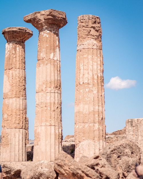 Free Explore the ancient Doric columns of the Temple of Heracles found in Agrigento, Italy. Stock Photo