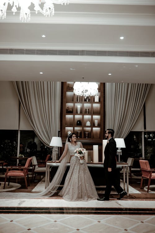 Smiling Newlyweds in Wedding Dress and Suit