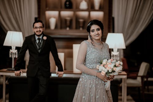 Smiling Newlyweds Standing and Posing