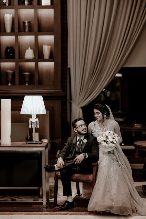 Smiling Newlyweds in Wedding Dress and Black Suit