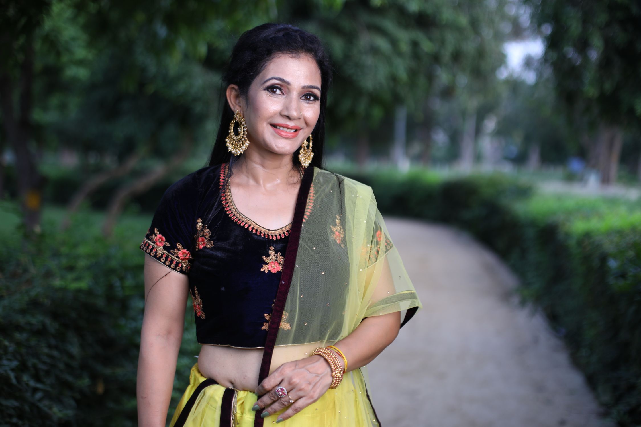 Smiling Woman in Traditional Clothing · Free Stock Photo