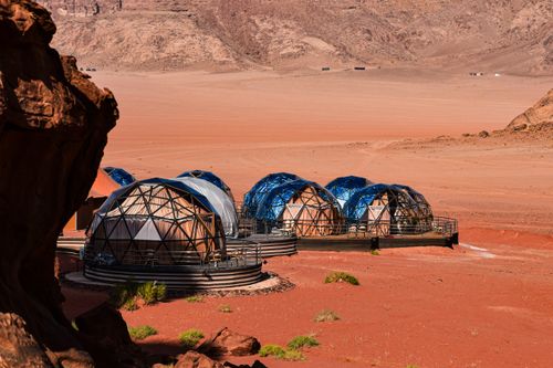 Free Geodesic domes in the stunning red desert landscape of Wadi Rum, Jordan, offering a unique travel experience. Stock Photo