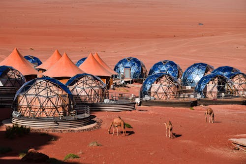 Houses with Glass Walls on Desert