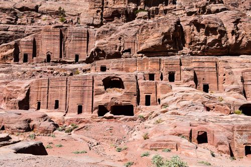 Free Discover the ancient rock-cut tombs in Petra, showcasing historical architecture in Jordan. Stock Photo