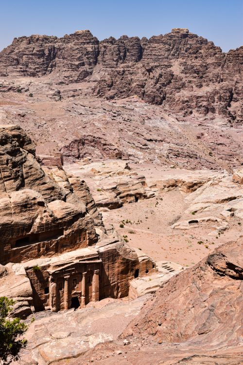 Free A breathtaking aerial view of Petra's ancient rock-cut buildings under the bright sun. Stock Photo