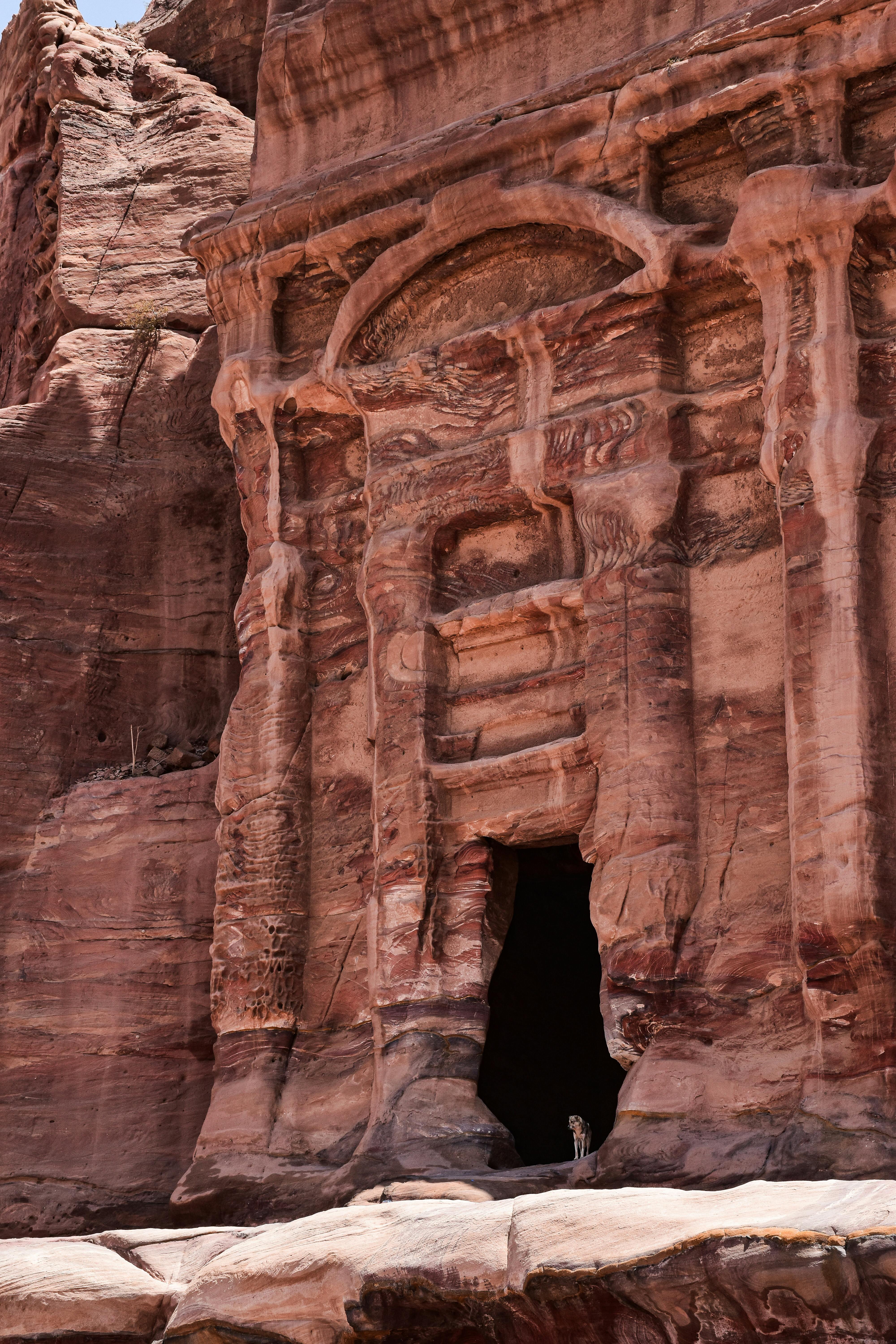 Majestic ancient rock temple facade in Petra, showcasing architectural splendor.