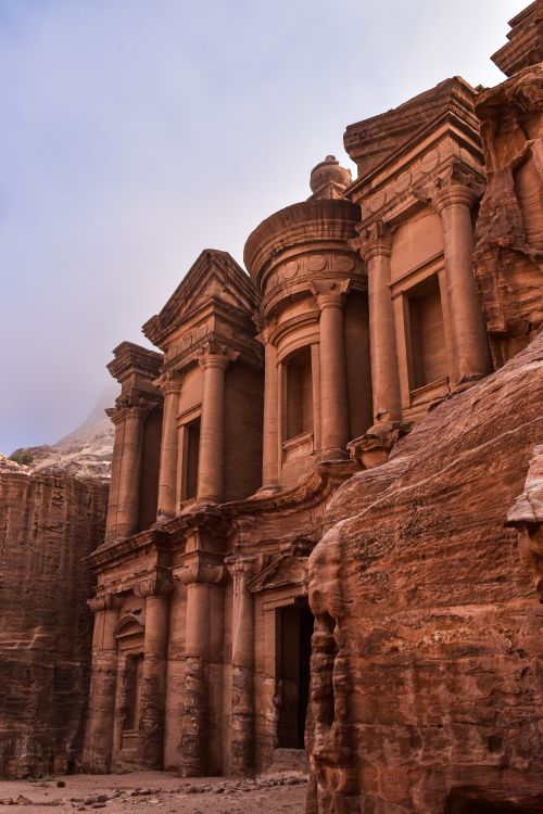 Free Explore the iconic ancient rock-cut architecture of Petra, Jordan, captured at dusk. Stock Photo