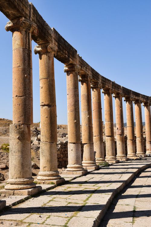 Free Explore the impressive ancient Roman colonnade in the historic city of Jerash, Jordan. Stock Photo