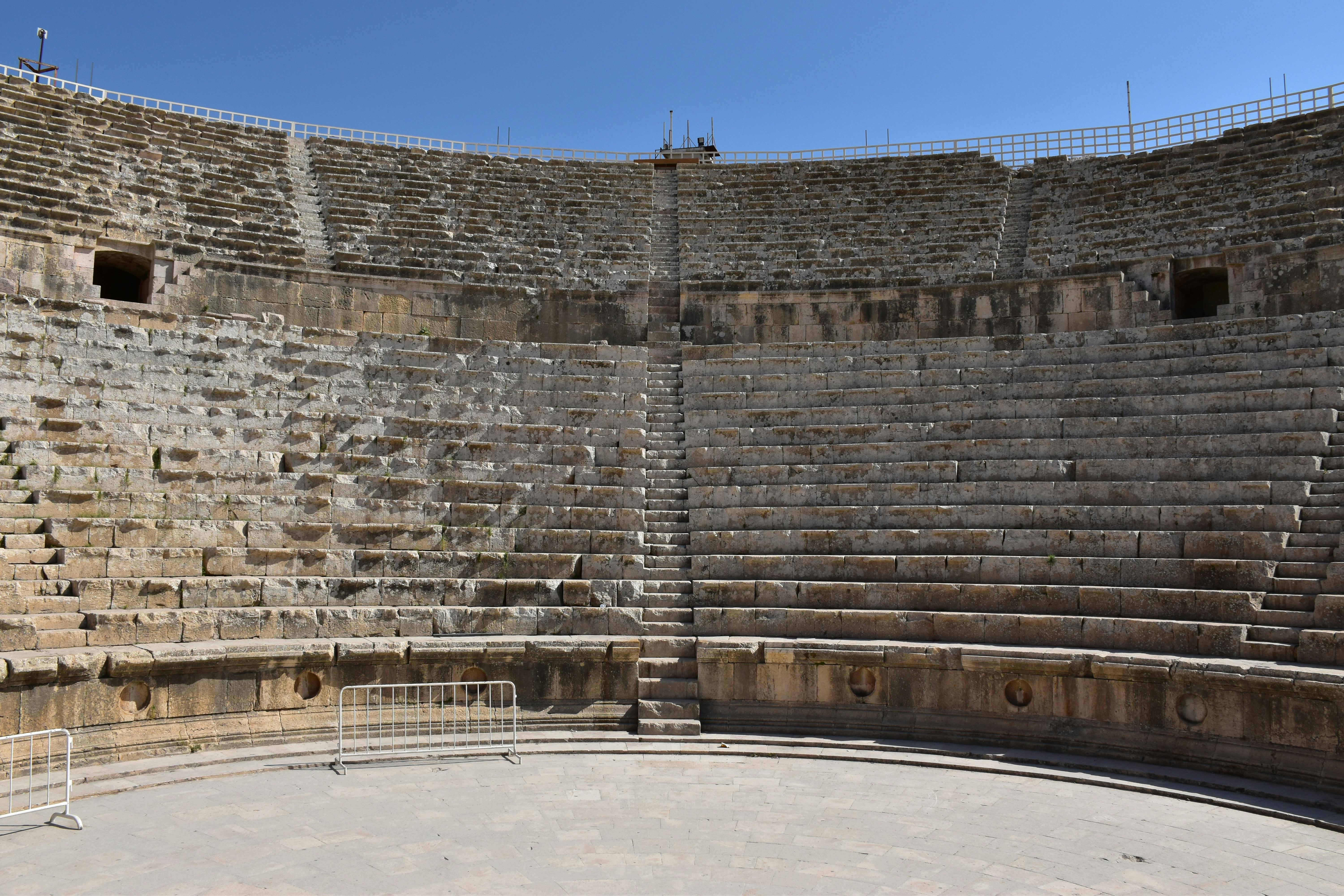 Free Explore this ancient Roman amphitheater in Jerash, showcasing stunning stone architecture. Stock Photo