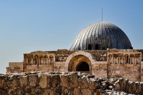 Free The iconic dome of the Umayyad Palace in Amman, Jordan against a clear blue sky. Stock Photo