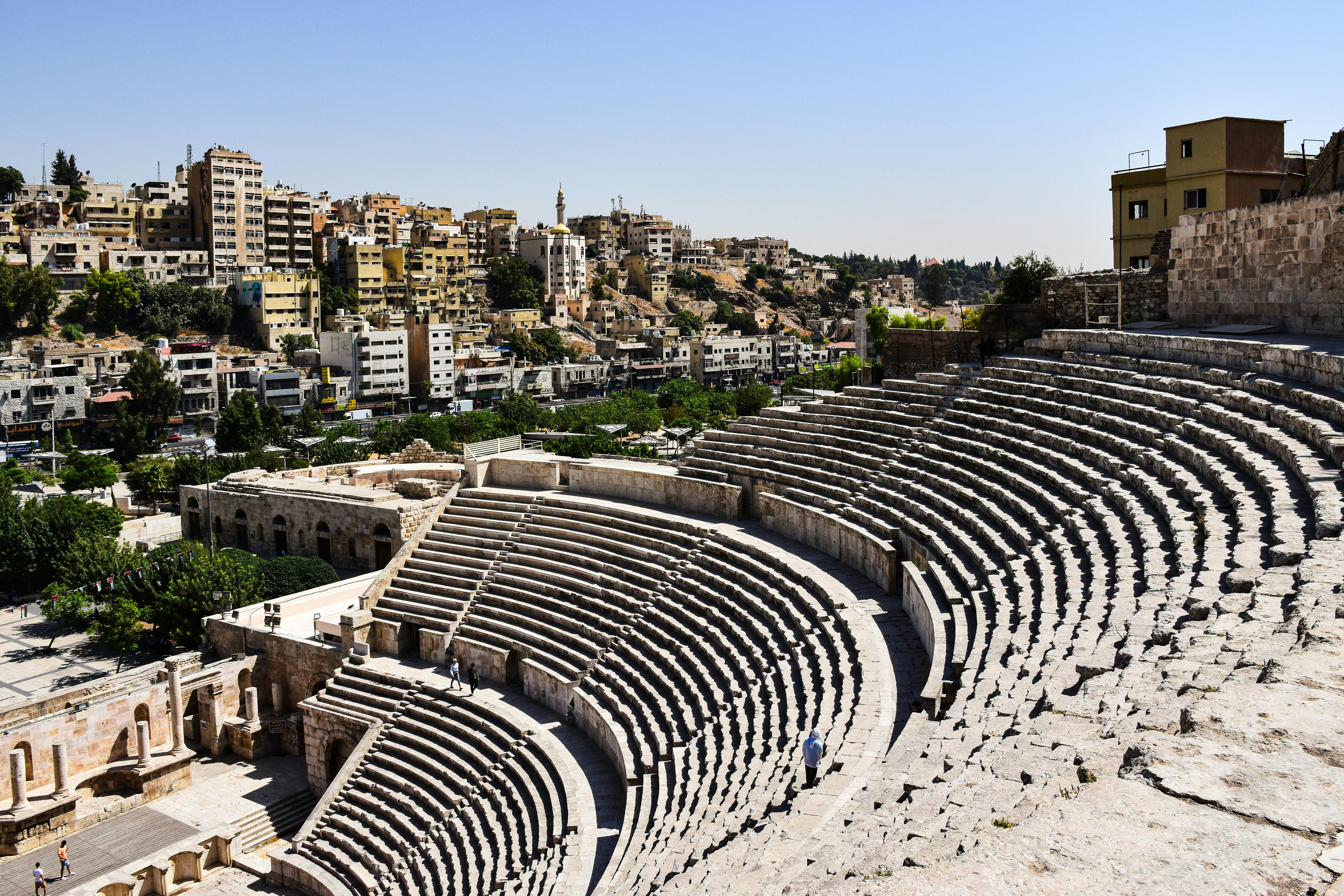 Free Explore the historic Roman theater in Amman amidst a vibrant urban landscape. Stock Photo