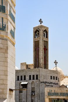 Vertical view of St. George's Church with cross towers in Amman, Jordan.