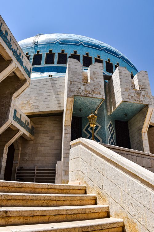 Free Exterior shot of King Abdullah I Mosque in Amman, highlighted by modern architecture and blue dome. Stock Photo
