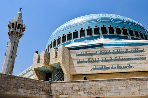 Free A stunning view of the King Abdullah I Mosque's blue dome and minaret in Amman, showcasing Islamic architecture. Stock Photo
