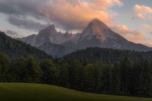 Free Stunning view of Bavarian mountains with lush forest at sunset in summer, capturing serene natural beauty. Stock Photo